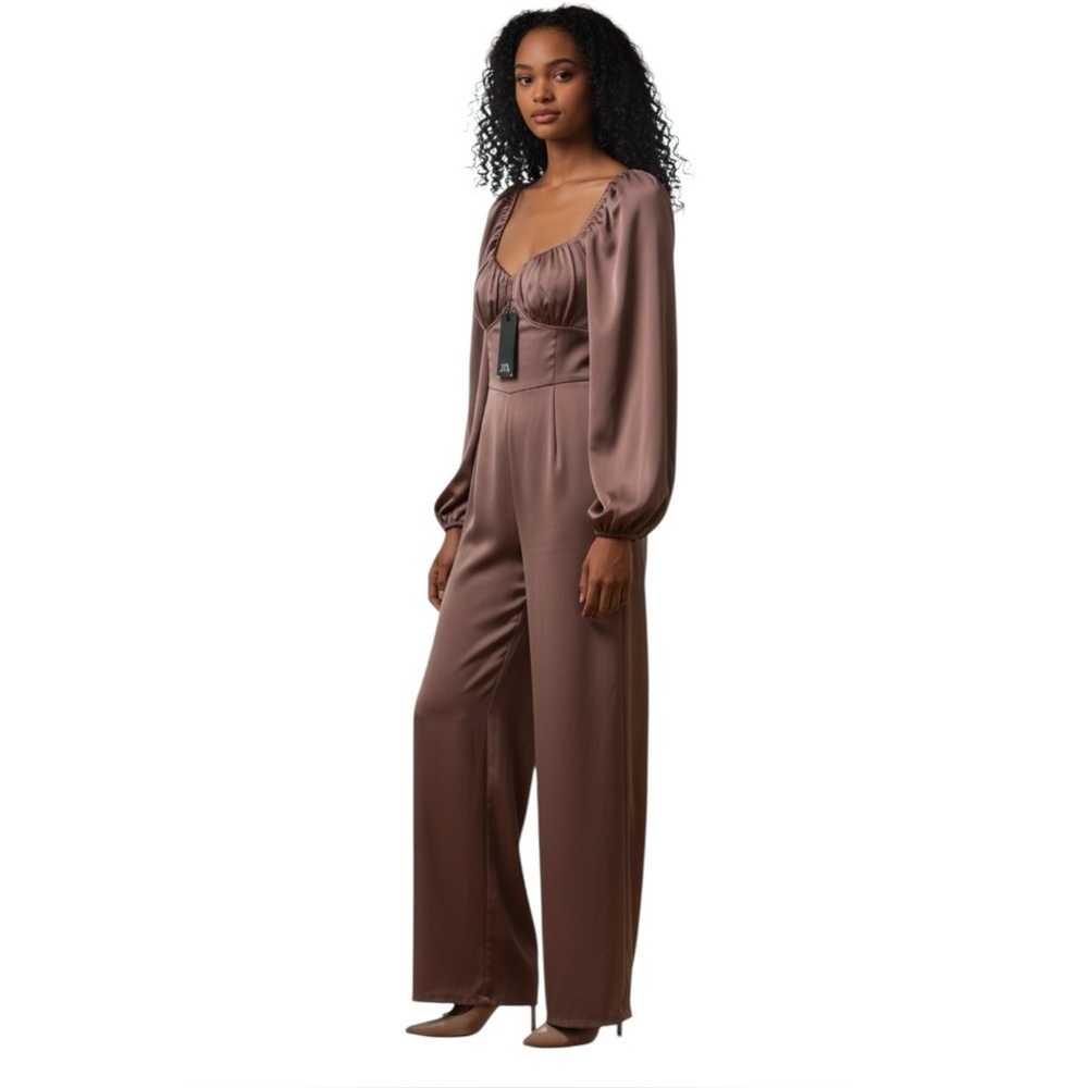New With Tags The Sang puffed Sleeve Chocolate Jumpsuit. Size Large.